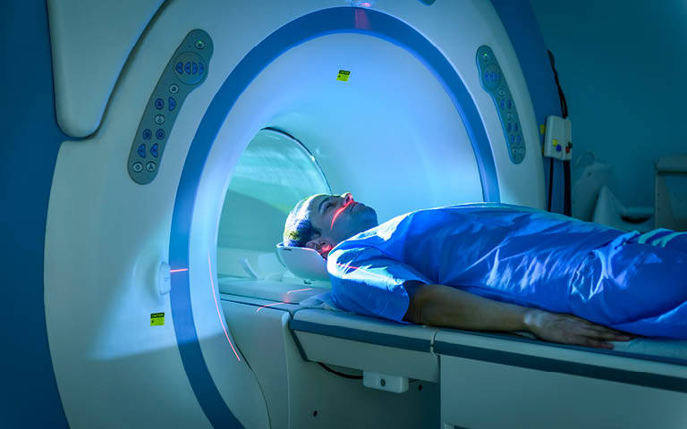Photo: Patient going into and MRI