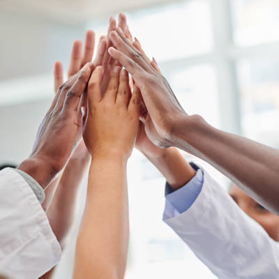 Group high-five among medical workers