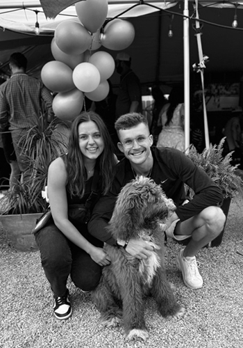Lauren Storm, MS2, with husband, Mitch Storm, and dog, Rush, enjoying a day at a crawfish boil in New Orleans.