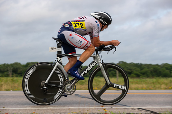 David D. Lawrence Jr., MD, FACR riding a time trial bicycle