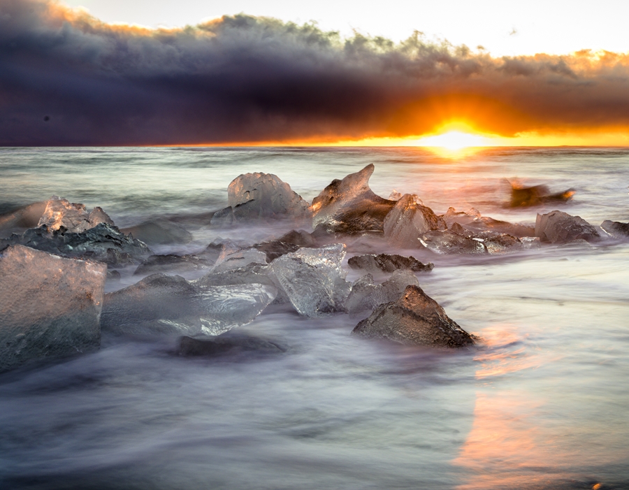 Photo of sunset and ice chunks in ocean in Iceland by Christopher B. Merritt, MD, FACR