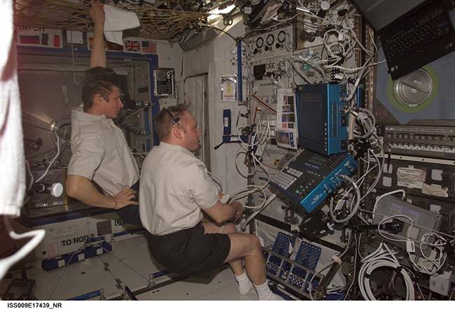 Astronaut Michael Fincke performs a venous Doppler ultrasound aboard the International Space Station